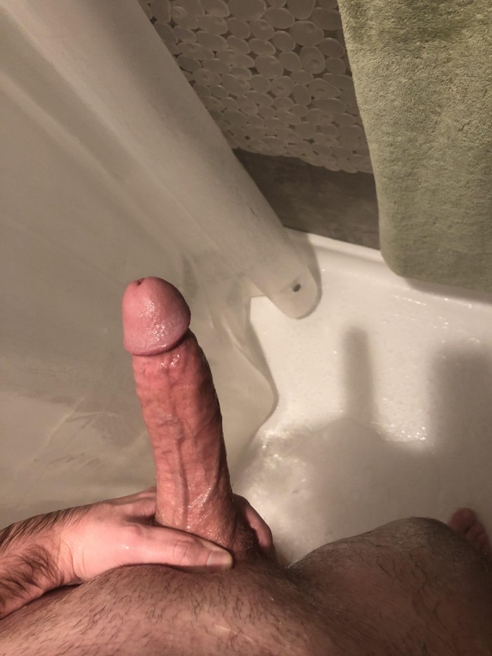 Girl with a black man in a shower