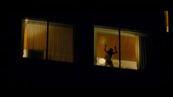 Peeping out the windows behind naked