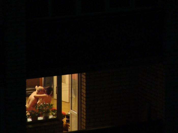 Naked woman in the window opposite