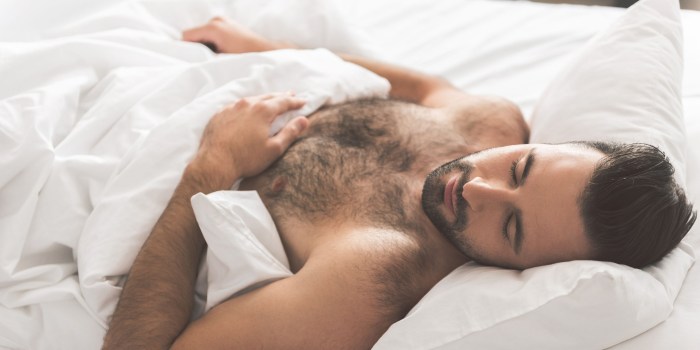 Sleeping young man naked