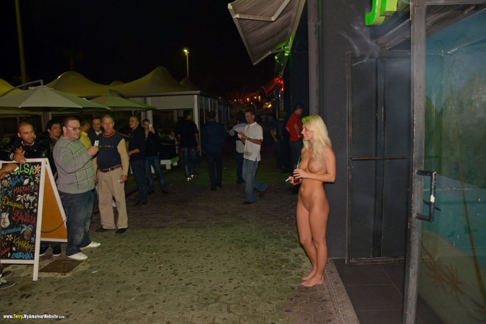 Woman undresses in public