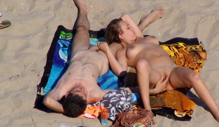 Drunk naked women on the beach