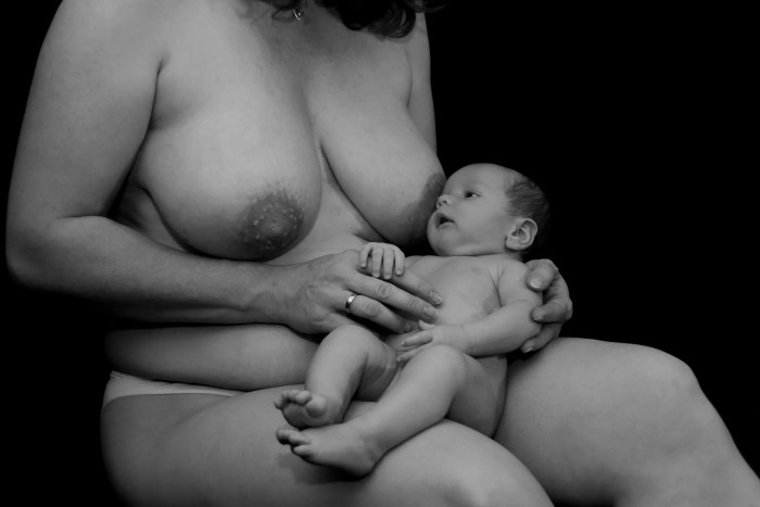 Naked woman with a baby