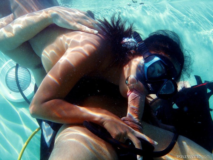 Naked girl in a pool with men