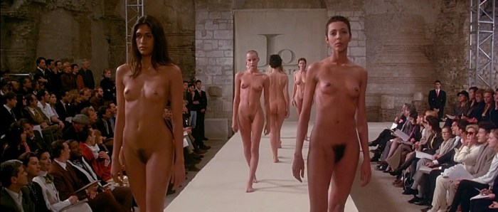 Naked women and men walk on the catwalk