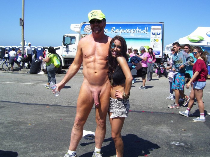 A man shows a member to passers -by