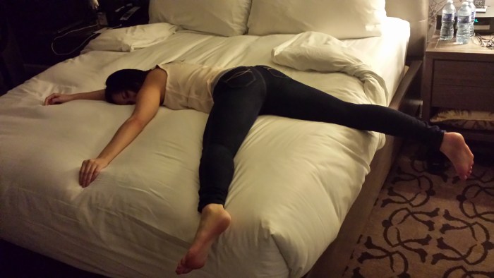 Naked on the bed spread her legs