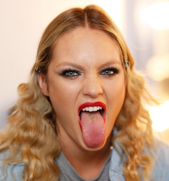 Girl with an open mouth in profile