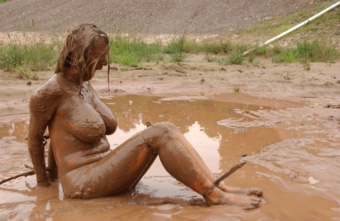 Naked beauties in mud