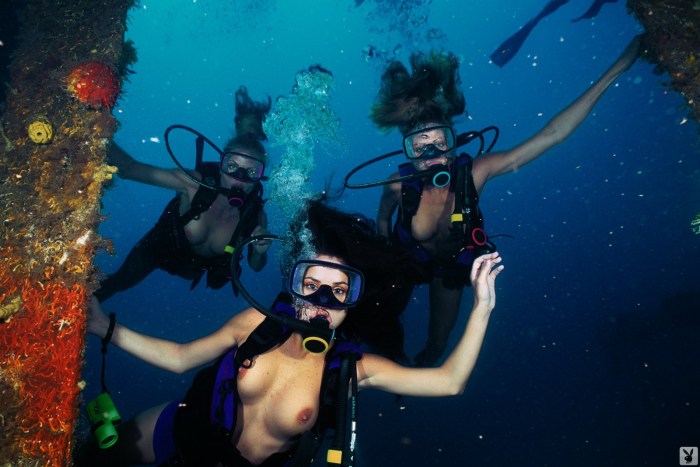 Naked women jump into the water