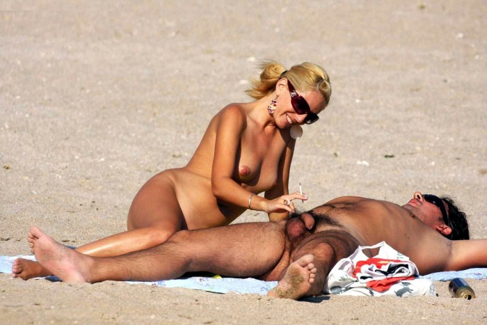 Naked women's butt on the beach