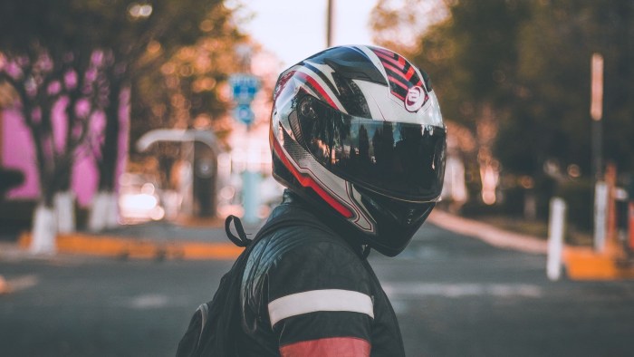 A man in a motorcycle helmet