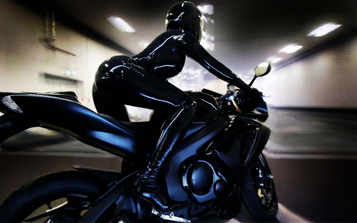 Motorcyclist in a leather jacket and helmet