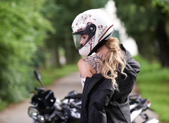 A guy on a motorcycle in a helmet