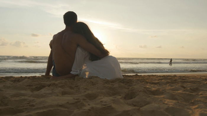 Lovers lie on the seashore
