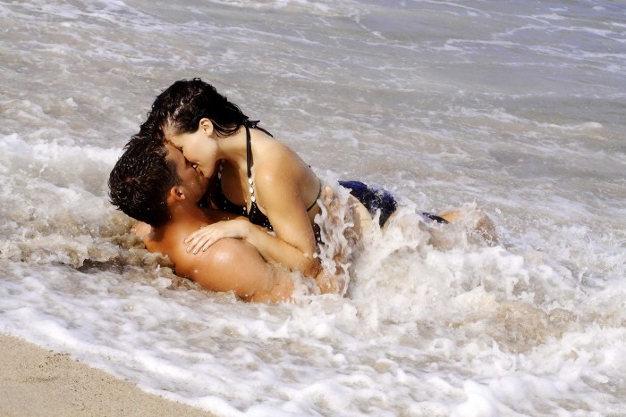 Naked couple on the shore
