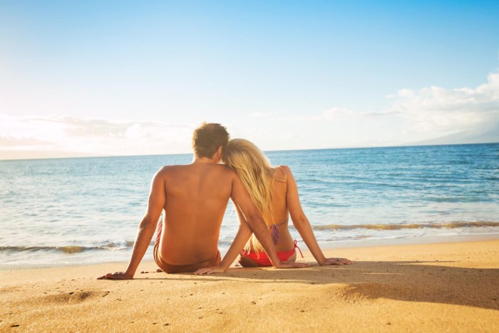 Naked beautiful young couples at sea