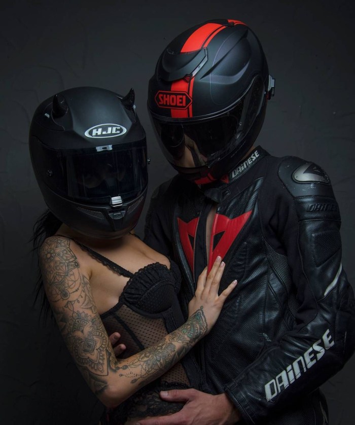A guy with a girl on a motorcycle