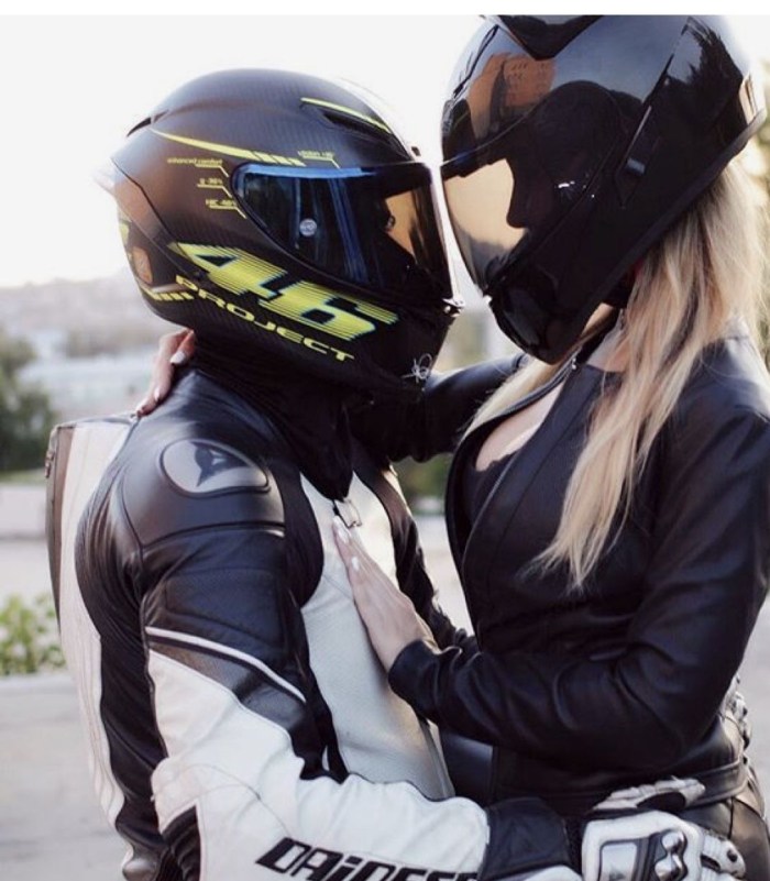 Girl on a motorcycle in a helmet