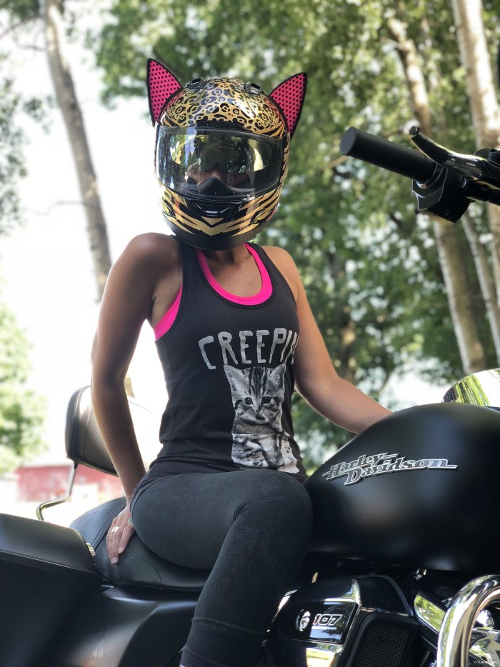 Girl on a motorcycle in a helmet