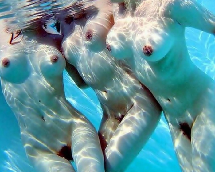 Naked beautiful priest underwater