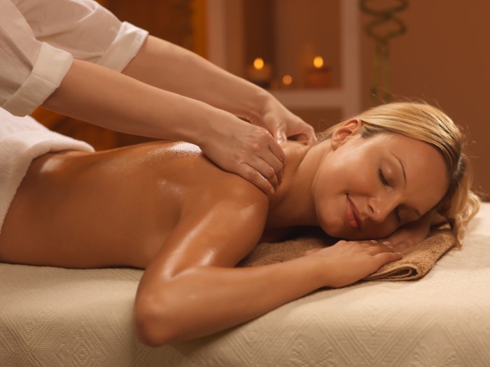 The guy massages the girl hair