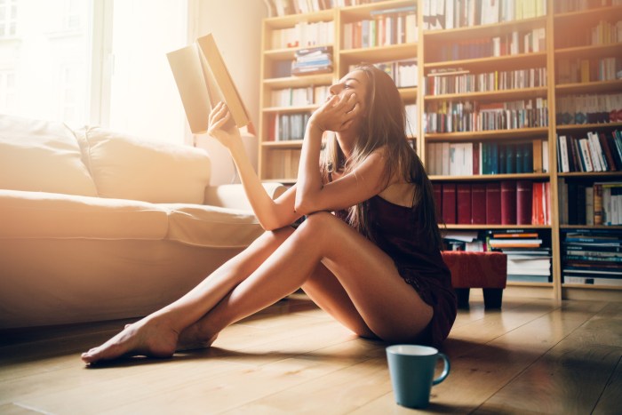 Modern gorgeous woman with a book