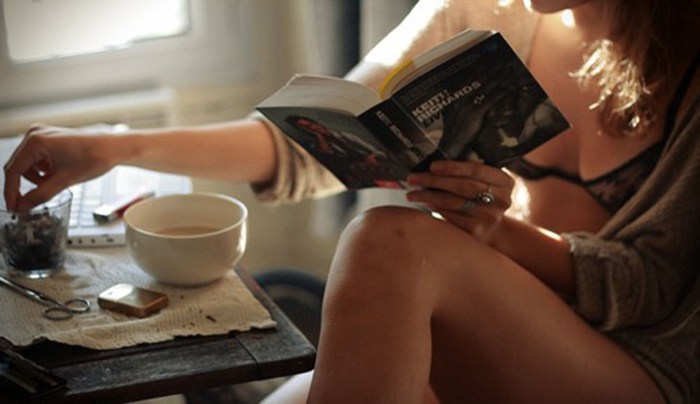 Girl in a cafe with a book