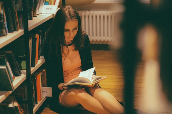Girl reads the book Nude