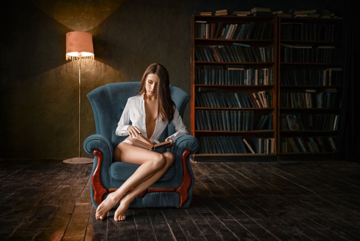 Girl in a skirt on the windowsill