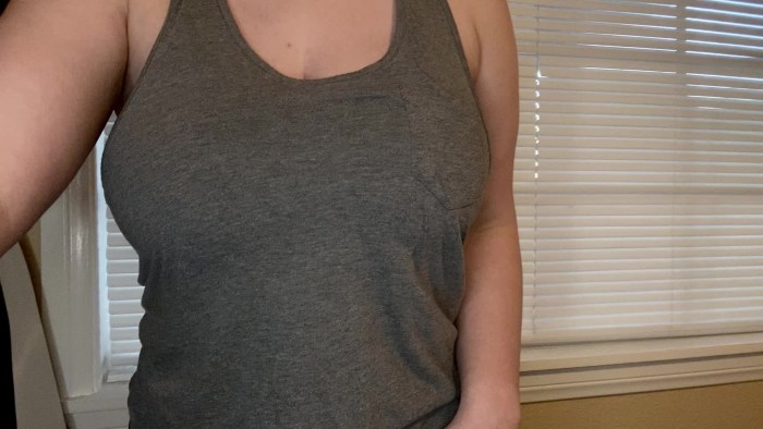 In the bra, the girl raises her hands