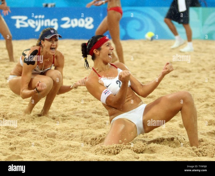 Beach volleyball players in thongs