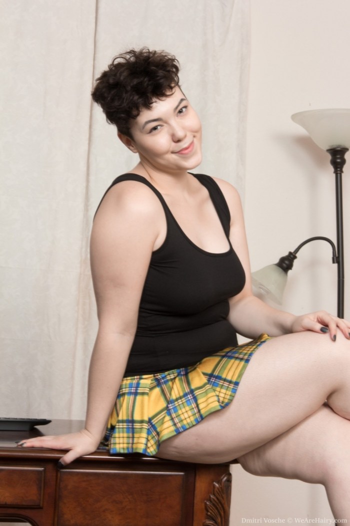 Mature in a dress on the bed