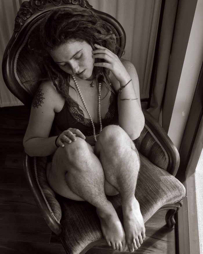 Adult unshaven women in a dress