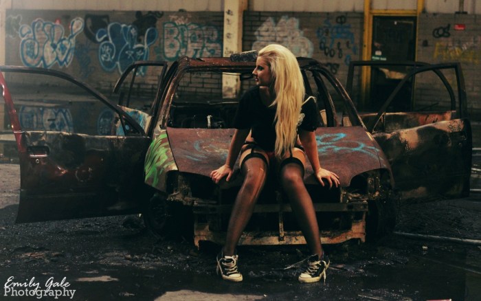 Photo shoot on a dump of cars