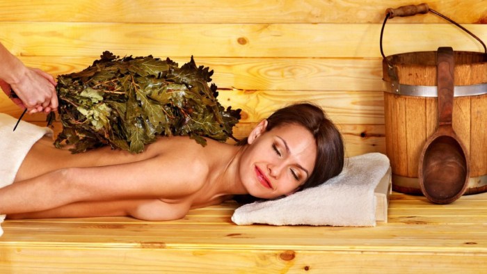Massage with a broom in a steam room
