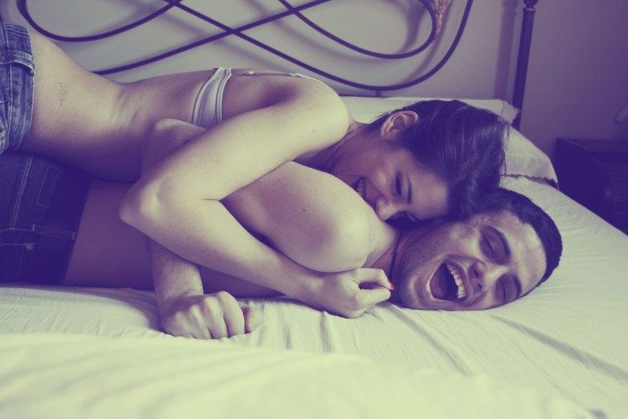 Guy and girl in bed
