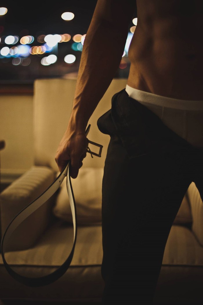 A man with a belt in his hands