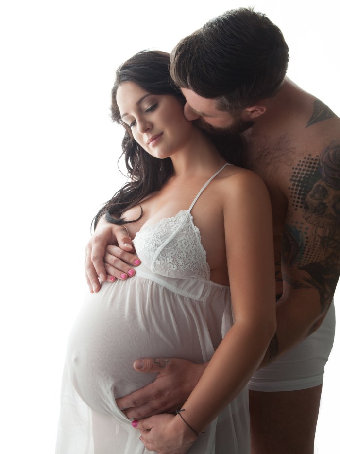 Beautiful pregnant women with a man