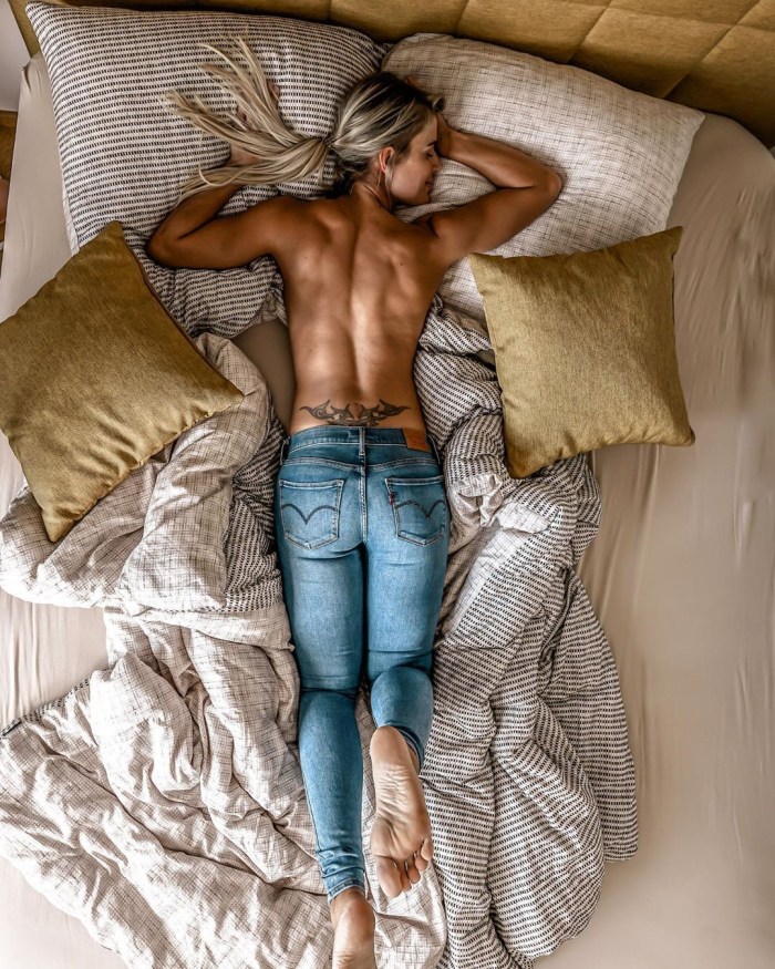 Girls in jeans in bed