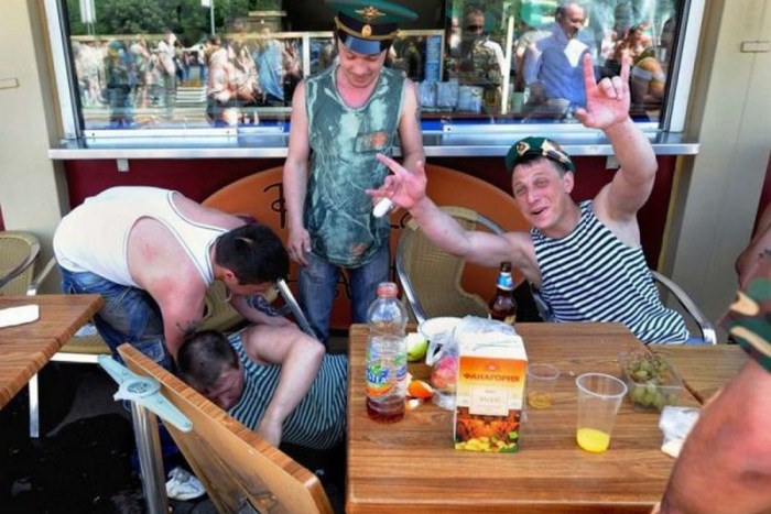 The man crossed himself and drank a bottle of gif