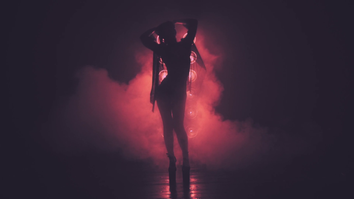Girl dances in the dark