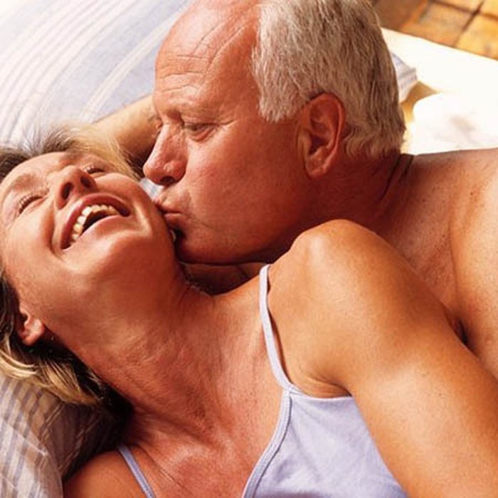 Guy and girl in bed