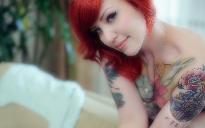 Red girls with tattoo breasts