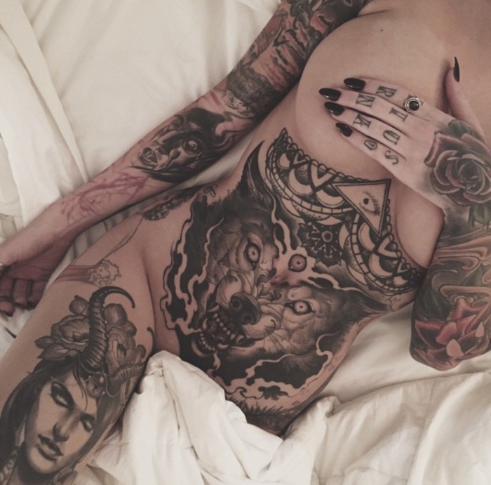 A lot of tattoos on the body of a girl