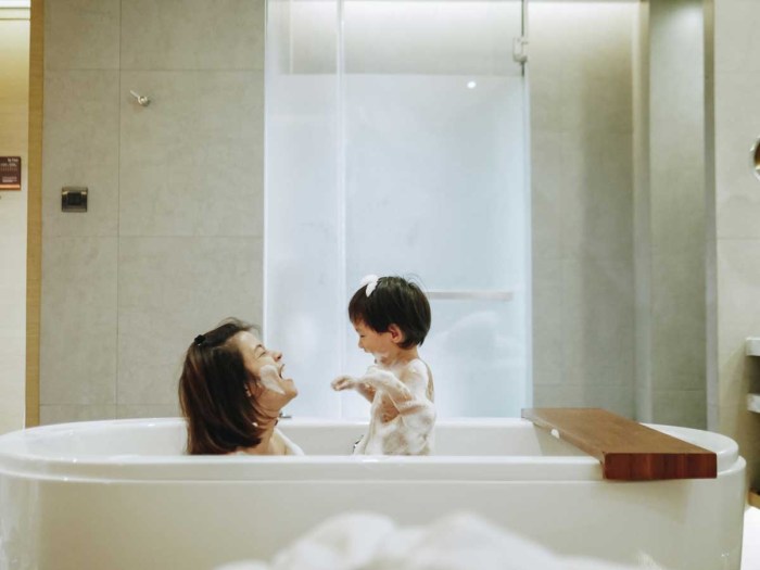 The boy undressed in the bathroom
