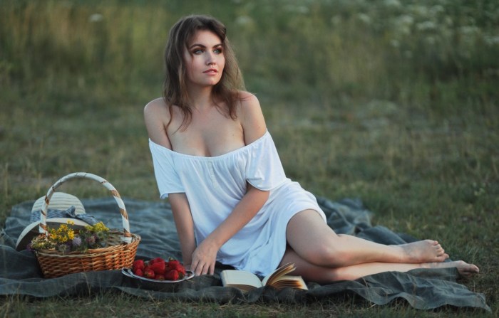 Girl in a dress barefoot with a neckline
