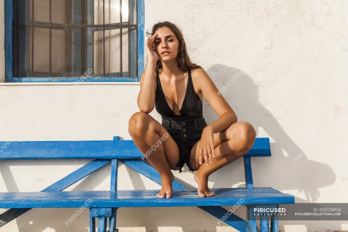 Girls squatting in a swimsuit