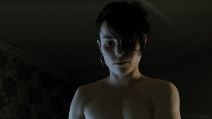 Naked Numi Rapas with a dragon tattoo