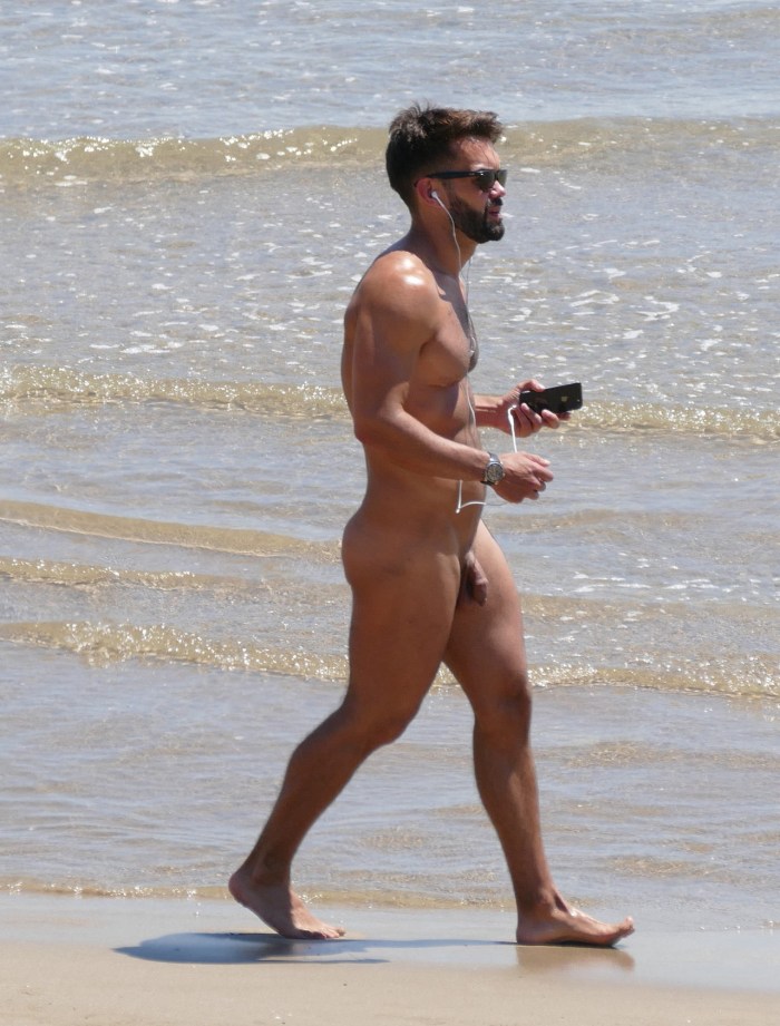 Two guys fuck on the beach
